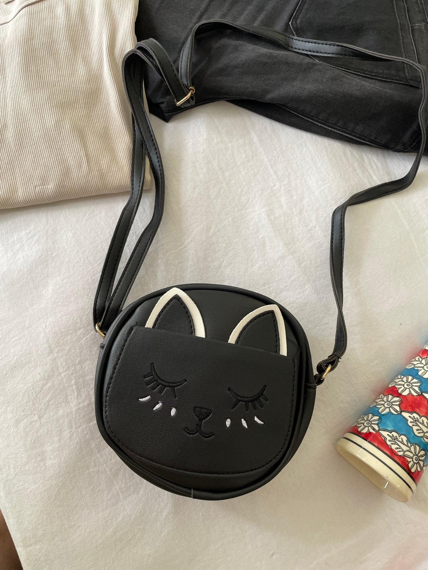 Shop kitty sling bags at Jewellery Lovers. Anti-tarnish, trendy & perfect for daily or festive wear. Free shipping available. jewellerylovers