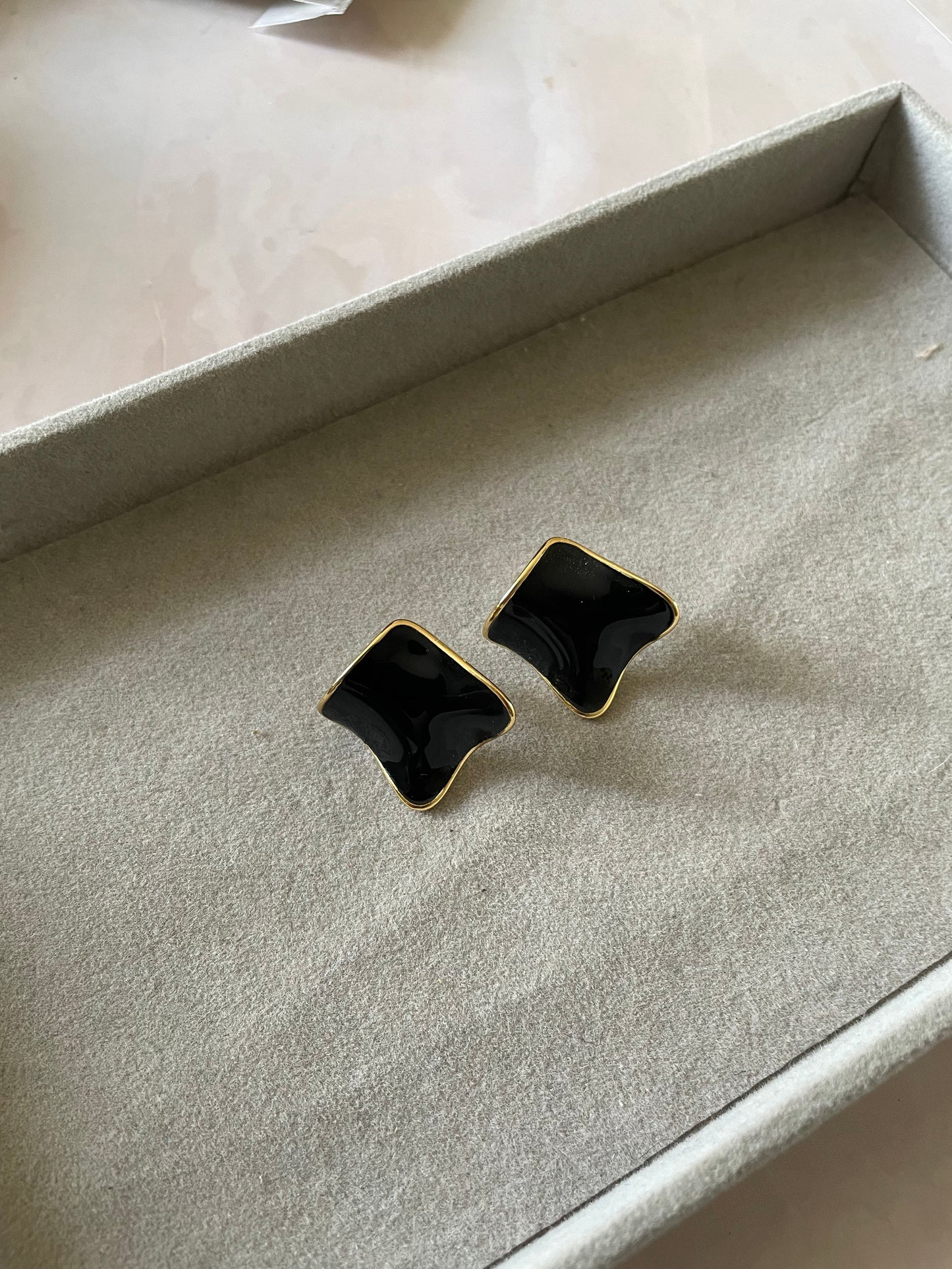 Black enamel studs