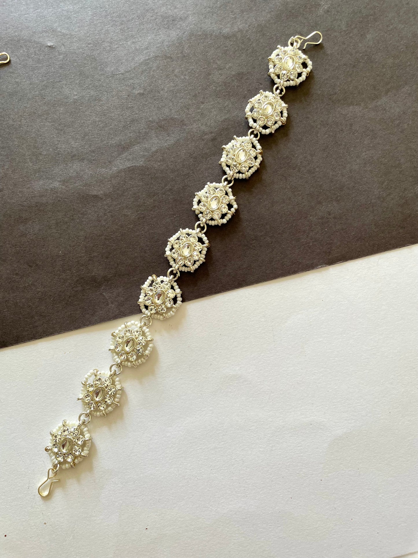 Shop mathapatti white shade flower mirror at Jewellery Lovers. Anti-tarnish, trendy & perfect for daily or festive wear. Free shipping available. jewellerylovers