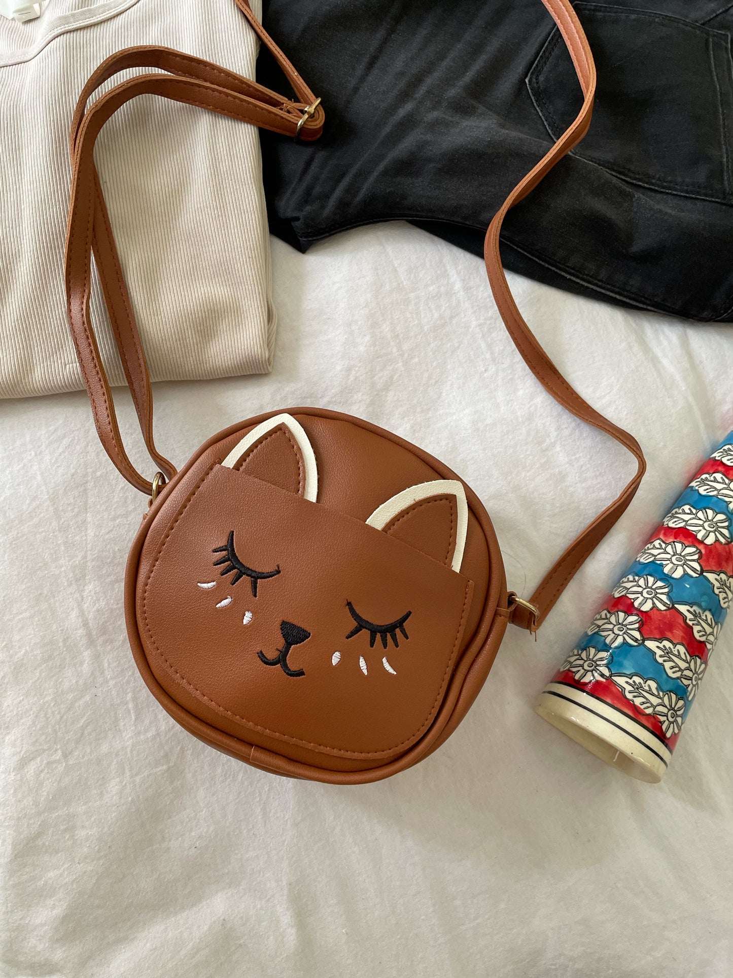 Kitty sling bags