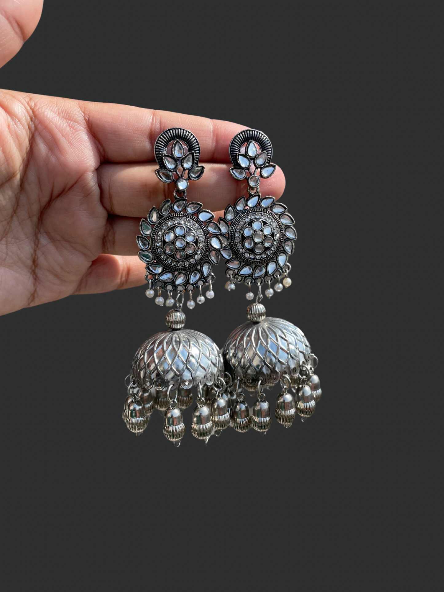 Shop flower drop silver shiny jhumka at Jewellery Lovers. Anti-tarnish, trendy & perfect for daily or festive wear. Free shipping available. jewellerylovers