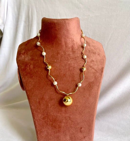 Gold necklace with white beads