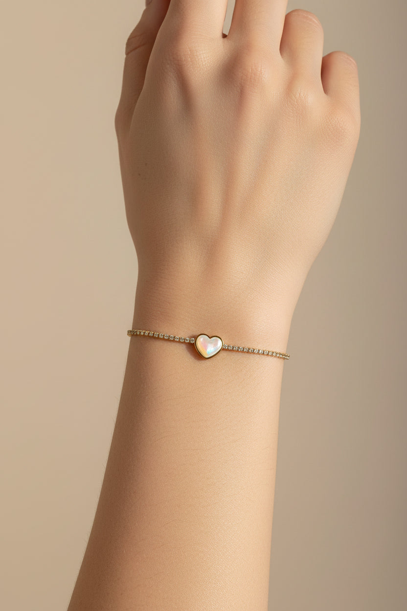 Bracelet with a heart-shaped gemstone on a beige card