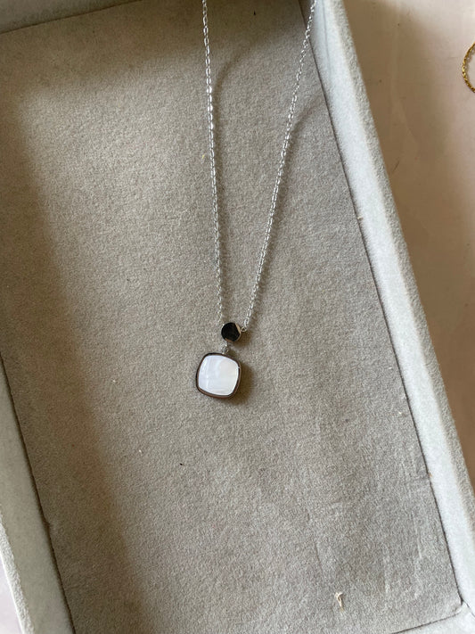 White silver stone pendent