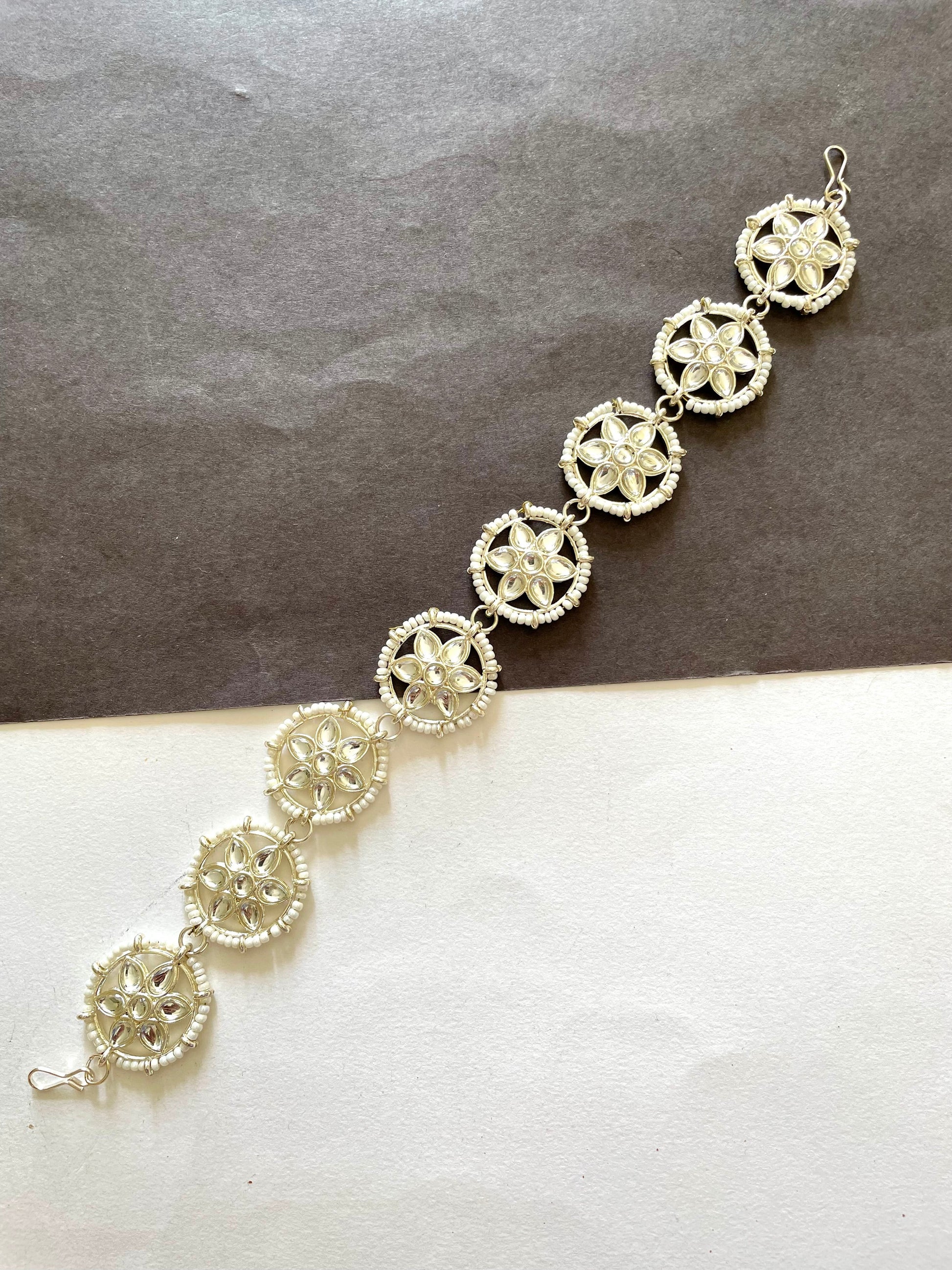 Shop mathapatti flower golden shade with pearls at Jewellery Lovers. Anti-tarnish, trendy & perfect for daily or festive wear. Free shipping available. jewellerylovers