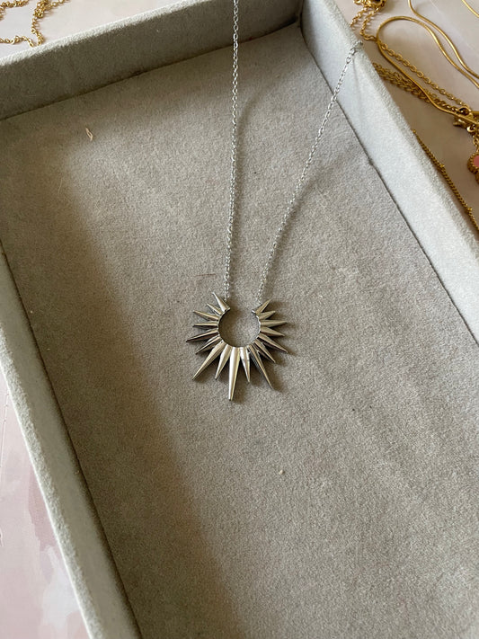 Circular silver pendent