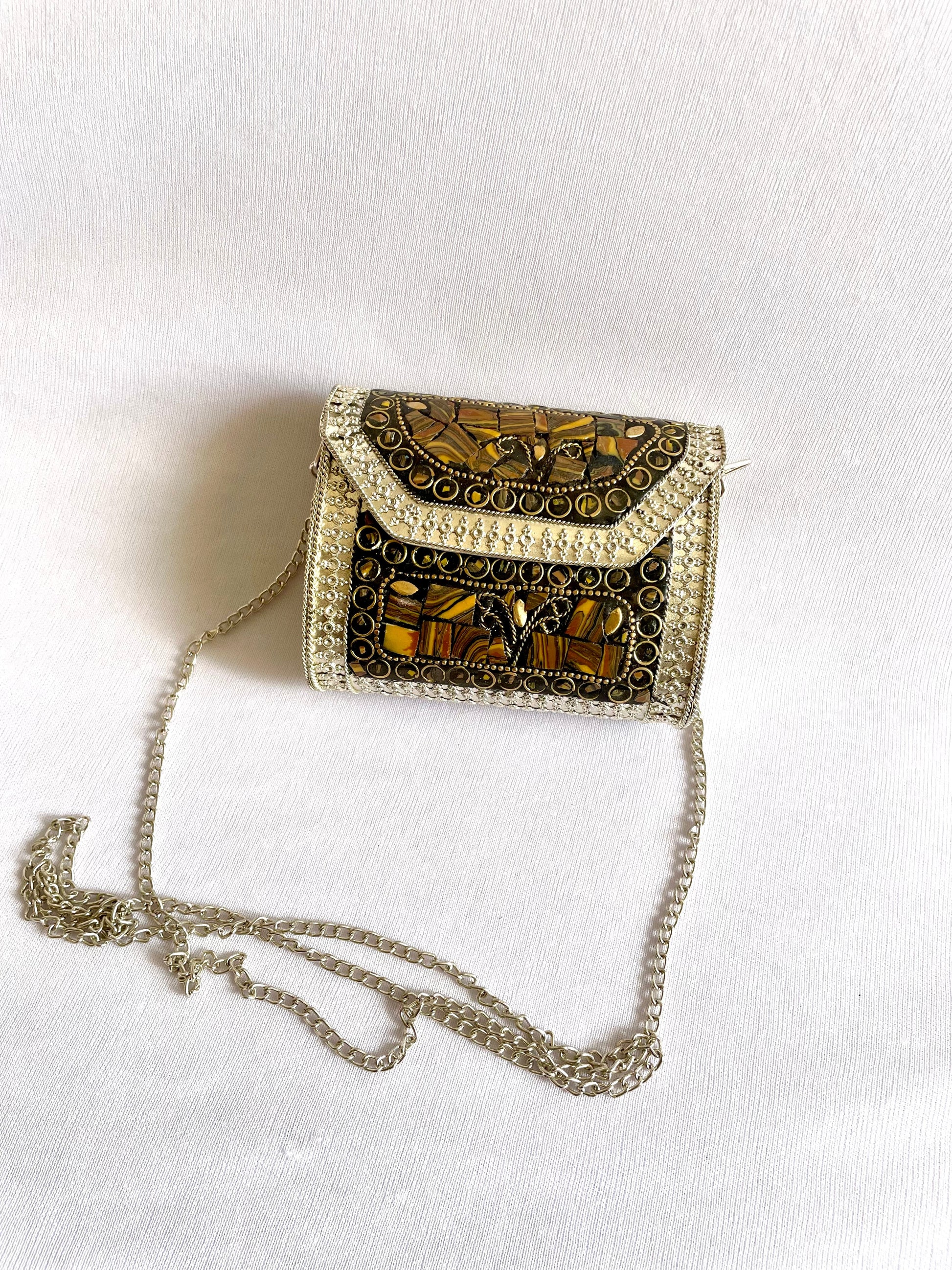 Shop brown brass sling bag at Jewellery Lovers. Anti-tarnish, trendy & perfect for daily or festive wear. Free shipping available. jewellerylovers